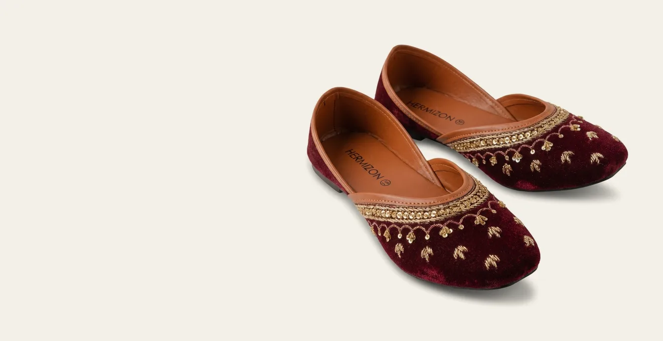 Aditri maroon velvet jutti with hand-worked gold zardozi embroidery